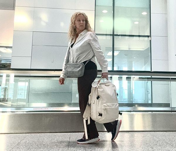 She Buys Travel editor in an airport